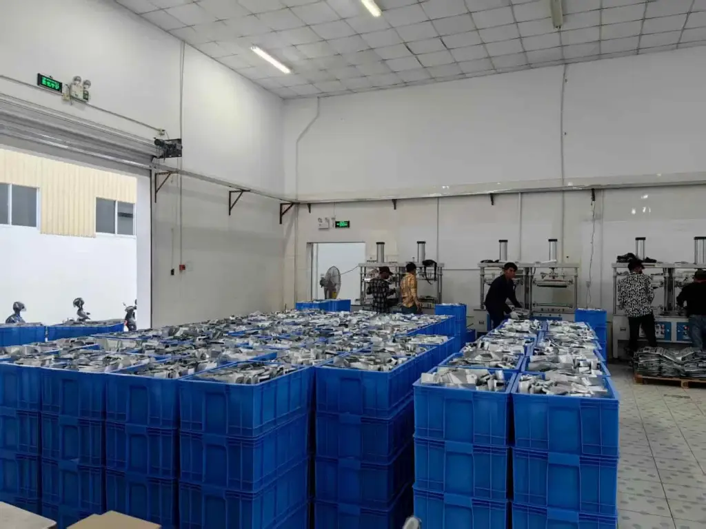 Cryozin hot and cold pack production workshop with packed components in blue bins