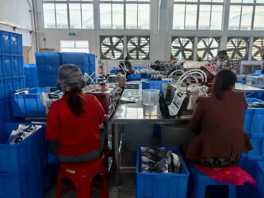 Workers assembling hot and cold therapy packs on a Cryozin production line