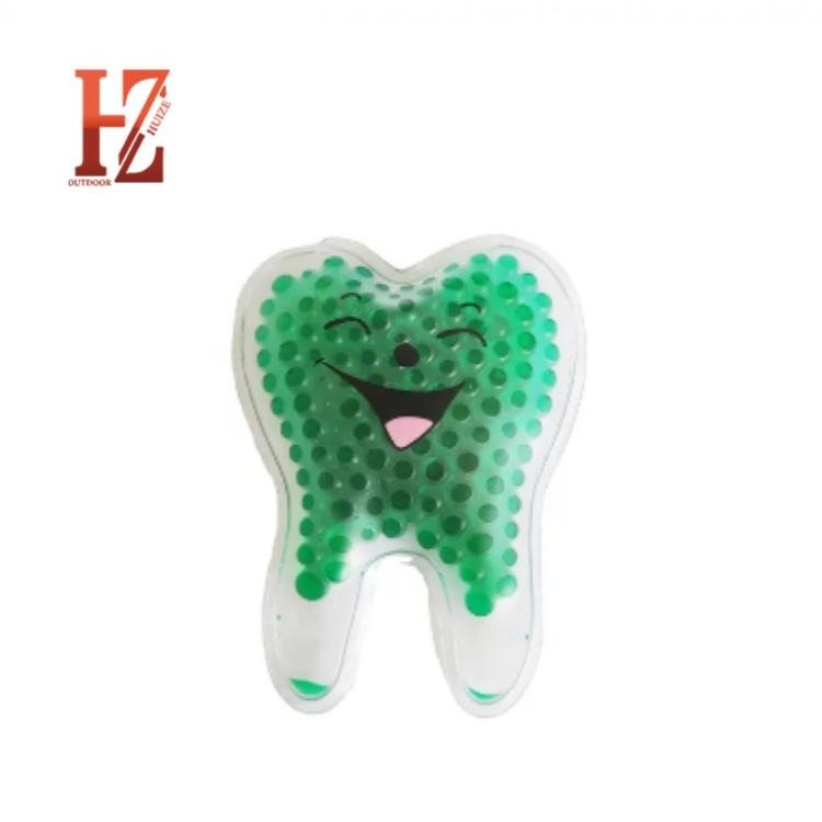 Green tooth-shaped gel-bead pack with a printed smiling face