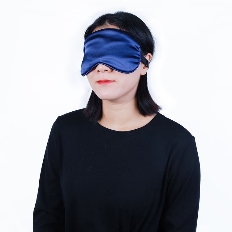 Blue fabric-covered eye wrap worn over the eyes