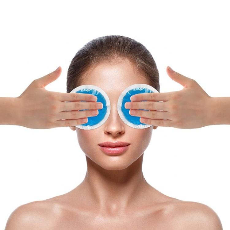 Round blue pads shown over closed eyes in a supplier use illustration