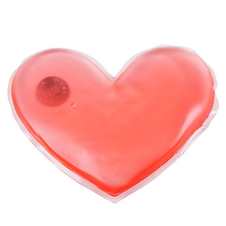 Pink heart-shaped heat pack with visible disc