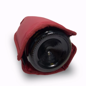 Red bottle cooling sleeve fitted around a wine bottle base