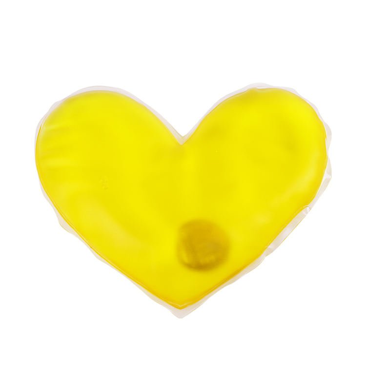 Yellow heart-shaped heat pack with an activation disc