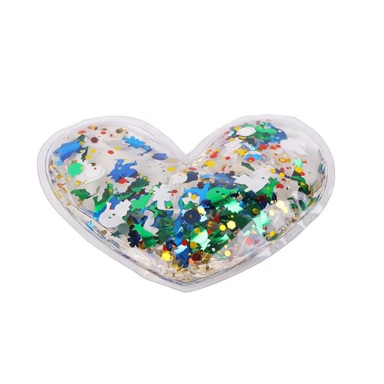 Catalog view of a clear heart-shaped pouch with multicolored decorative sequins and a transparent sealed rim