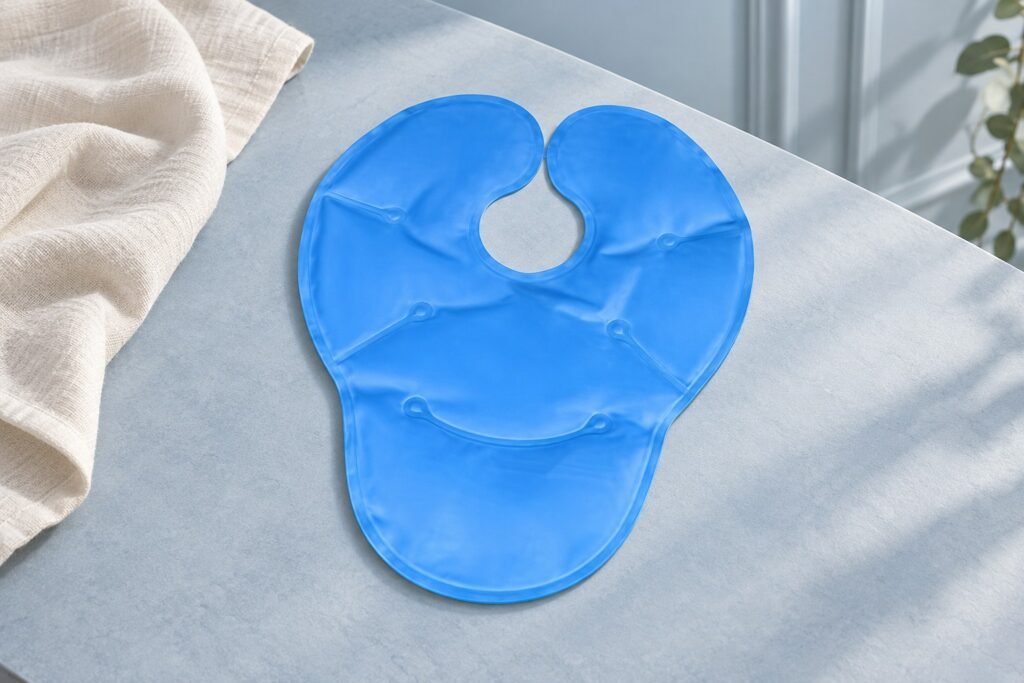Blue contoured gel pouch with a keyhole opening and extended lower panel on a pale sample table