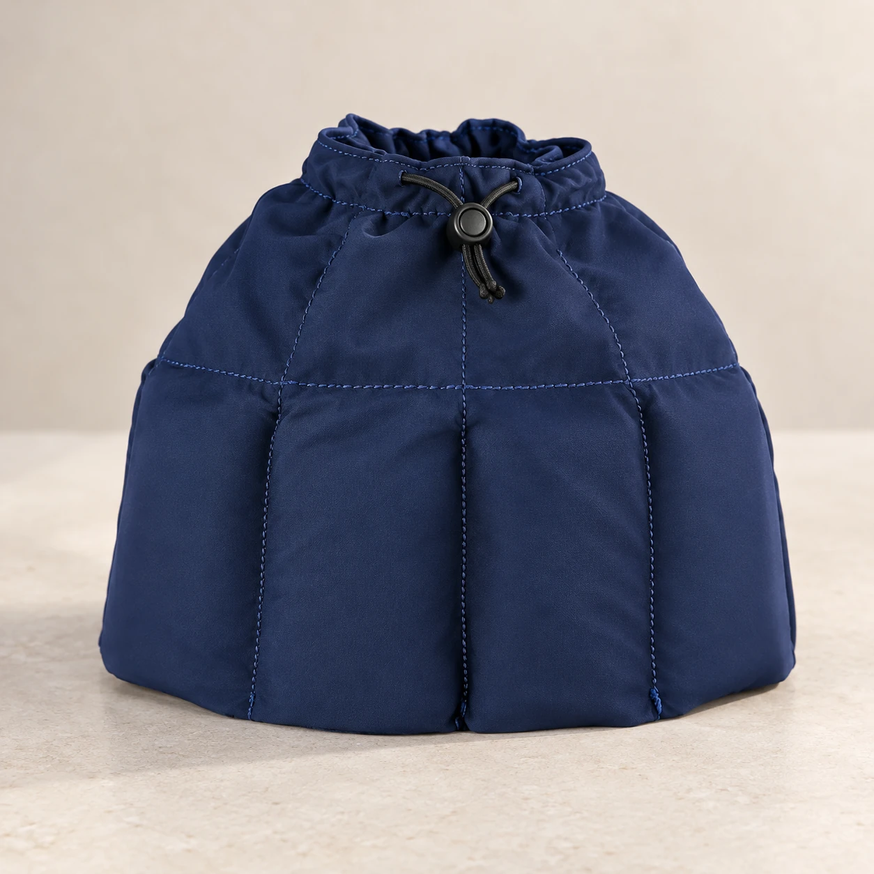 Navy drawstring head wrap with multiple lower insert pockets