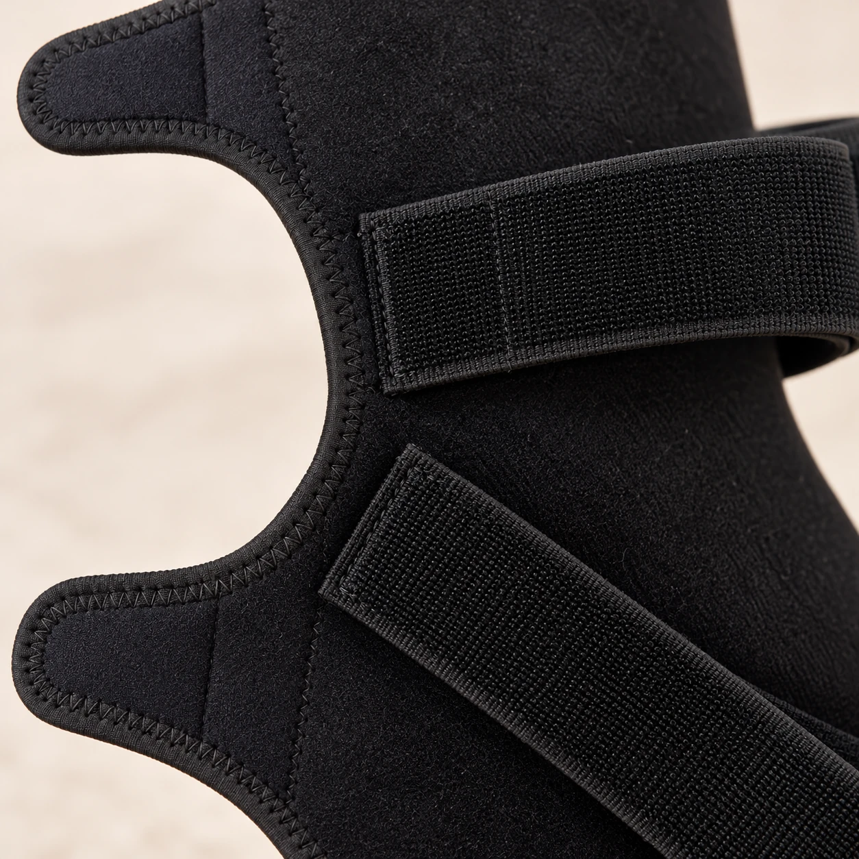 Close view of an equine wrap fastening strap and bound edge