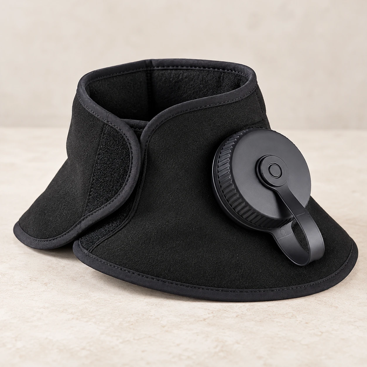 Black contoured refillable neck wrap with a large side fill cap