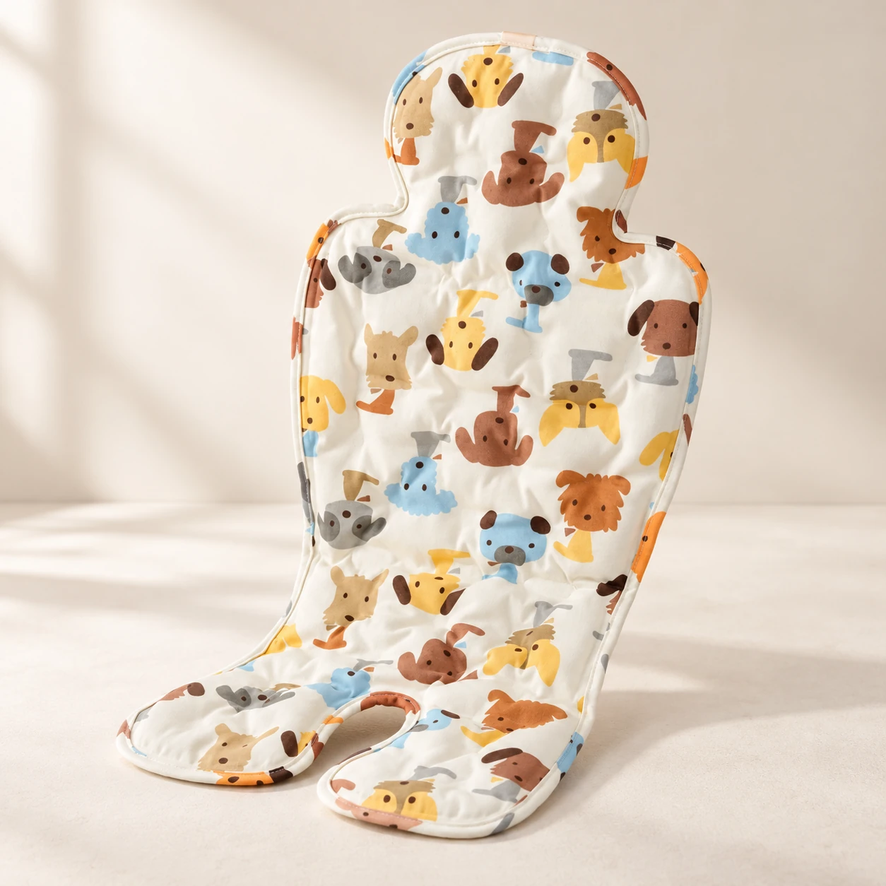 Animal-print contoured stroller cooling seat pad on a neutral surface