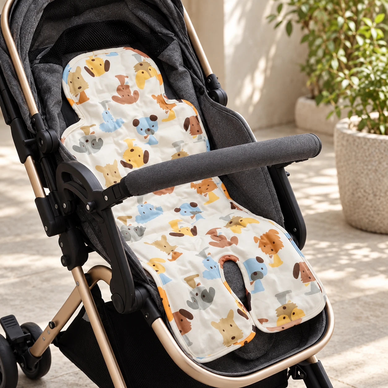 Animal-print cooling pad fitted in an empty black stroller